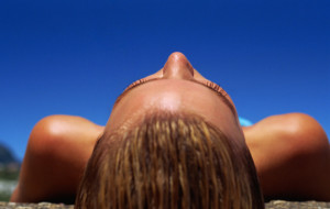 Close-up of woman sunbathing